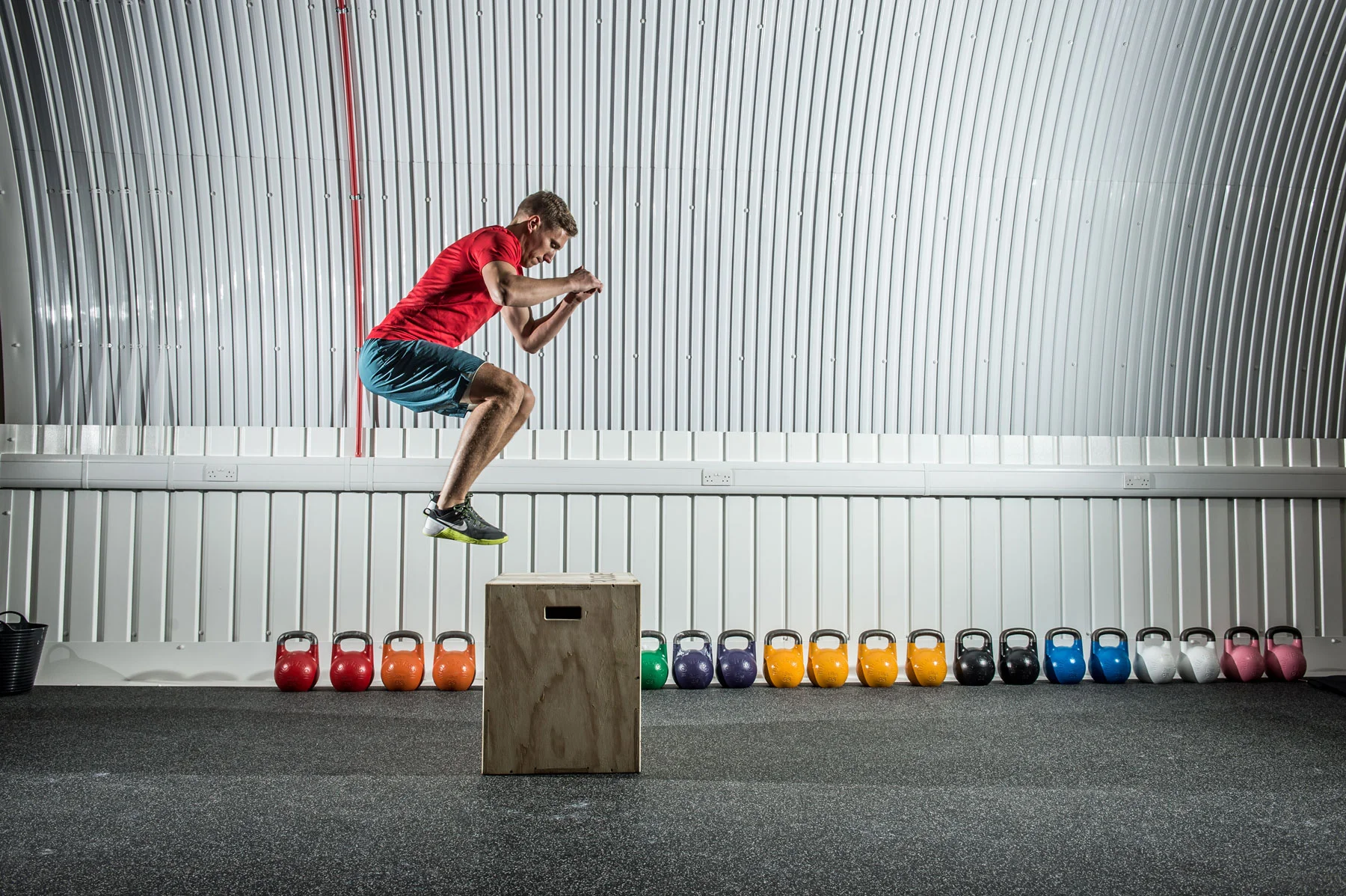 Action: metabolic conditioning circuits including box jumps are core to the 555 workouts.