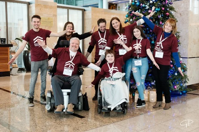 McGrath — seen here with 11-year-old Lewis Harper and his family —along with his team all wear the charity’s distinctive Muscle Warrior T-shirts for solidarity