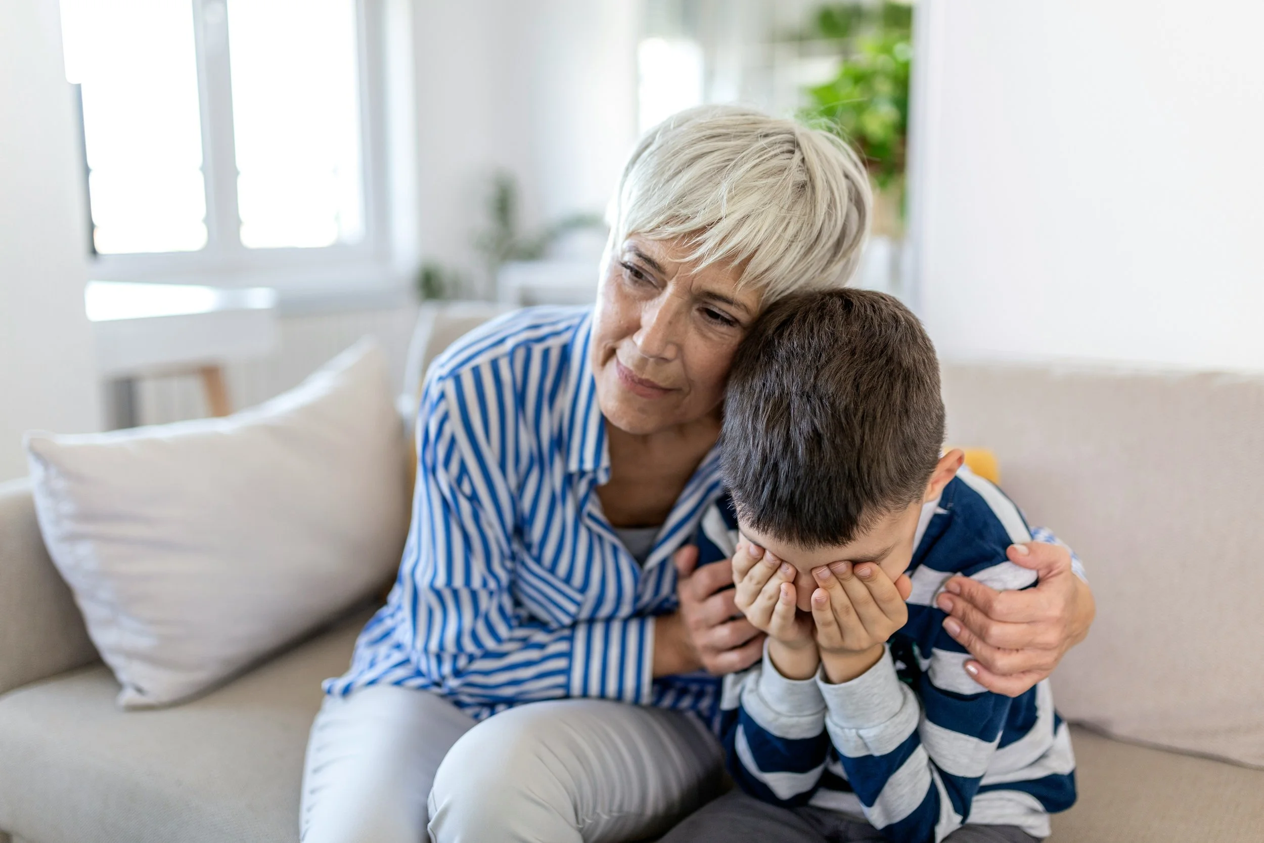 Mother comforting grieving child