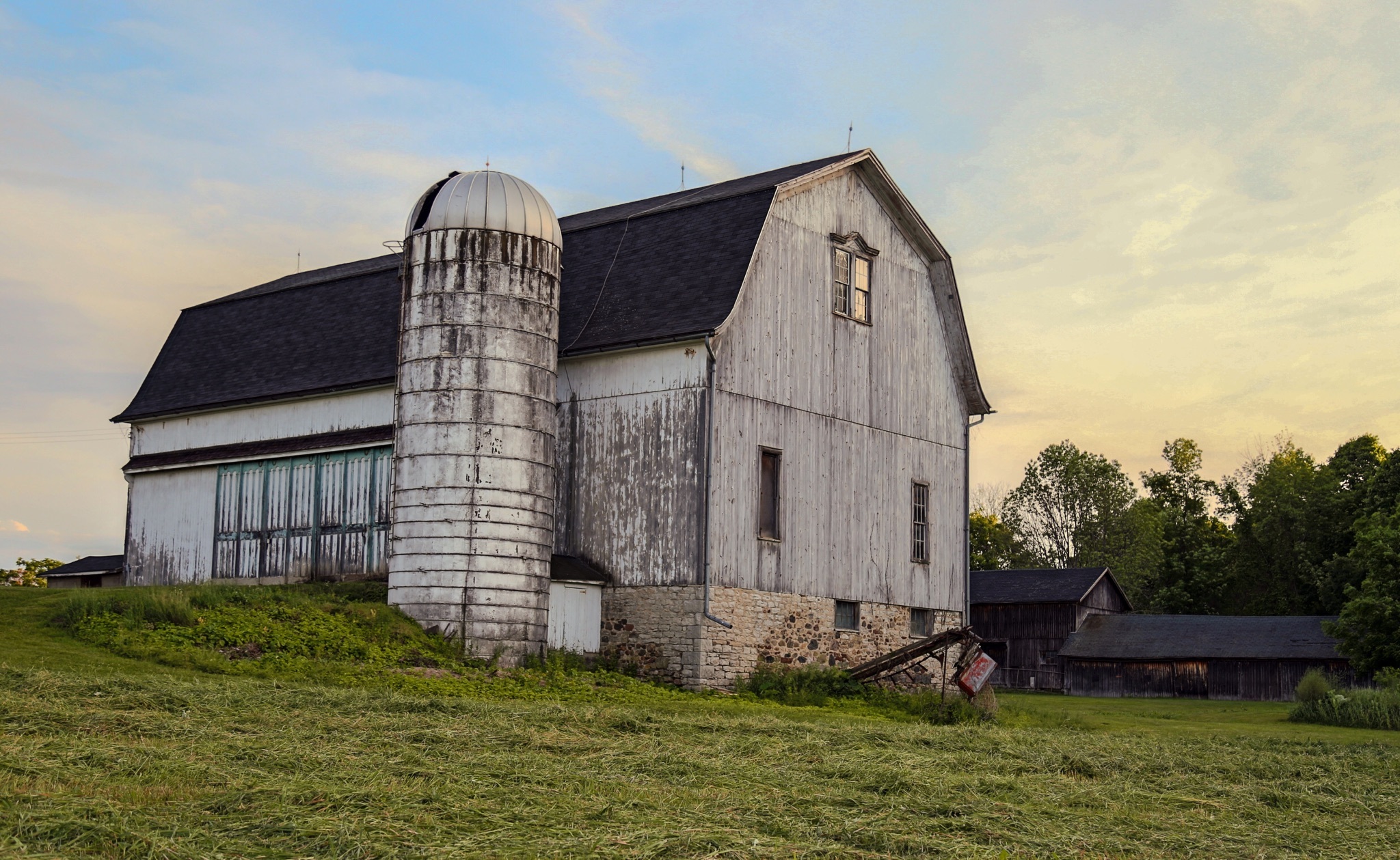 One of the barns built by J. T. Wells & Sons using the Wells patented truss design. This photo was taken before renovation began in 2016.