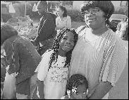 This photograph from the Public Art Master Plan of a family at the Powderhorn Farmer’s Market is one of many used to illustrate the Greenway's history and reflect the many cultures of people that live there. Photo by Tim Francisco