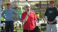 Wells Fargo’s Carolyn Roby addresses the crowd. Also pictured: Eric Hart, Midtown Greenway Coalition / Longfellow Community Council; Council Member Robert Lilligren .
