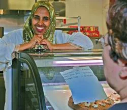 Faduma Hashi opened Starlight Cafe, her first store, inside theMidtown Global Market, marking a dream come true for this experiencedcaterer and mother of eight. Faduma recently received an African Development Center Achievement Award. Photo courtesy of African Development Center .