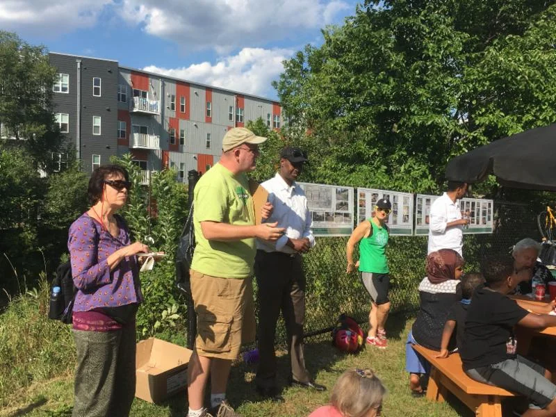 Soren Jensen welcomes participants to a Somali community meeting to gather ideas and feedback from residents