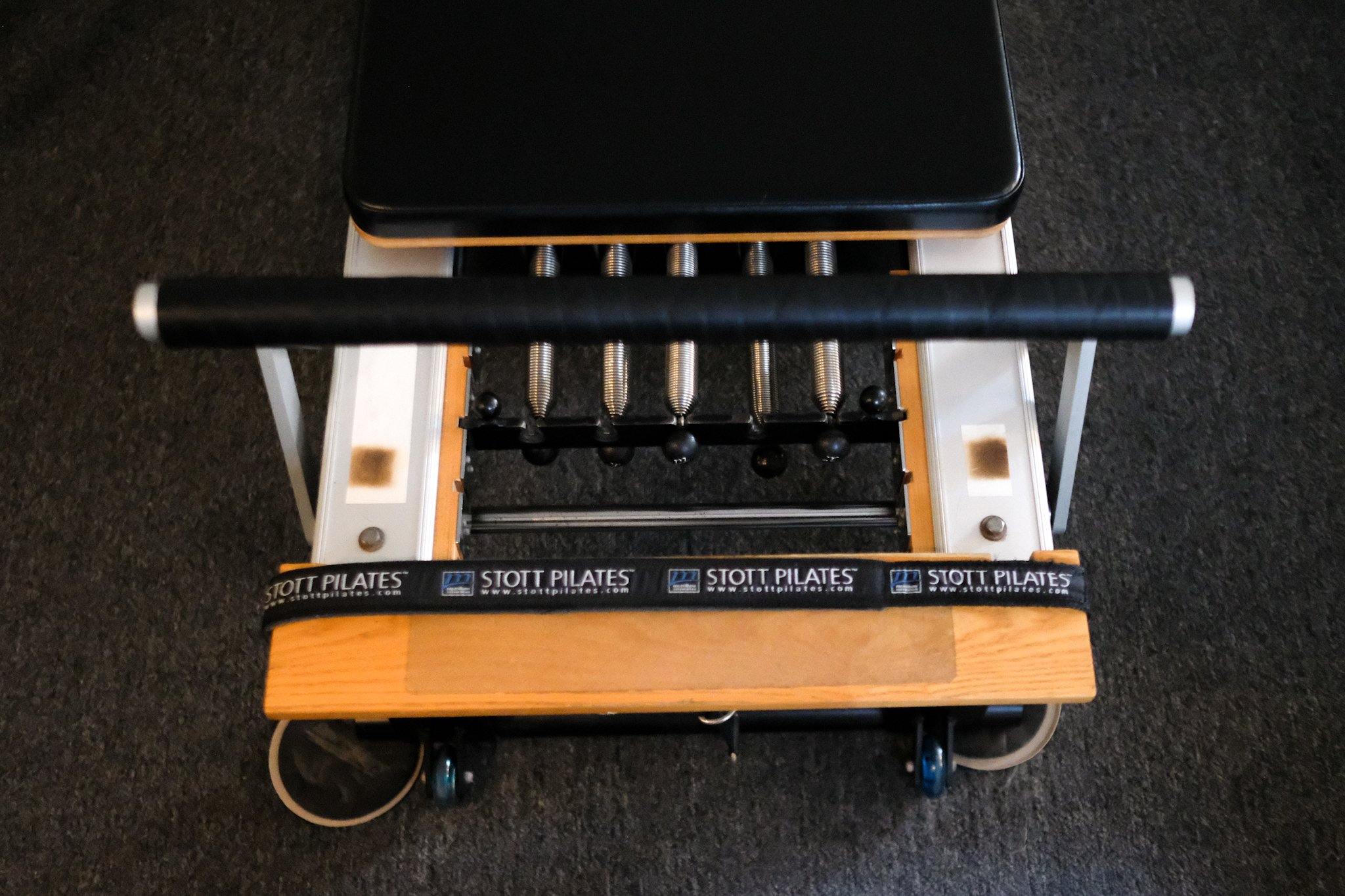 The Pilates reformer is the cornerstone of our Pilates classes. Its unique design features a sliding carriage, springs, and straps that provide resistance, helping to strengthen and tone muscles. The reformer allows for a wide range of exercises tha