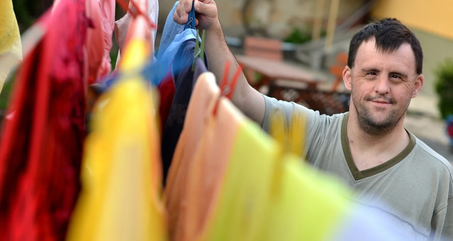 Ease-e Banner Man Hanging Clothes.jpg