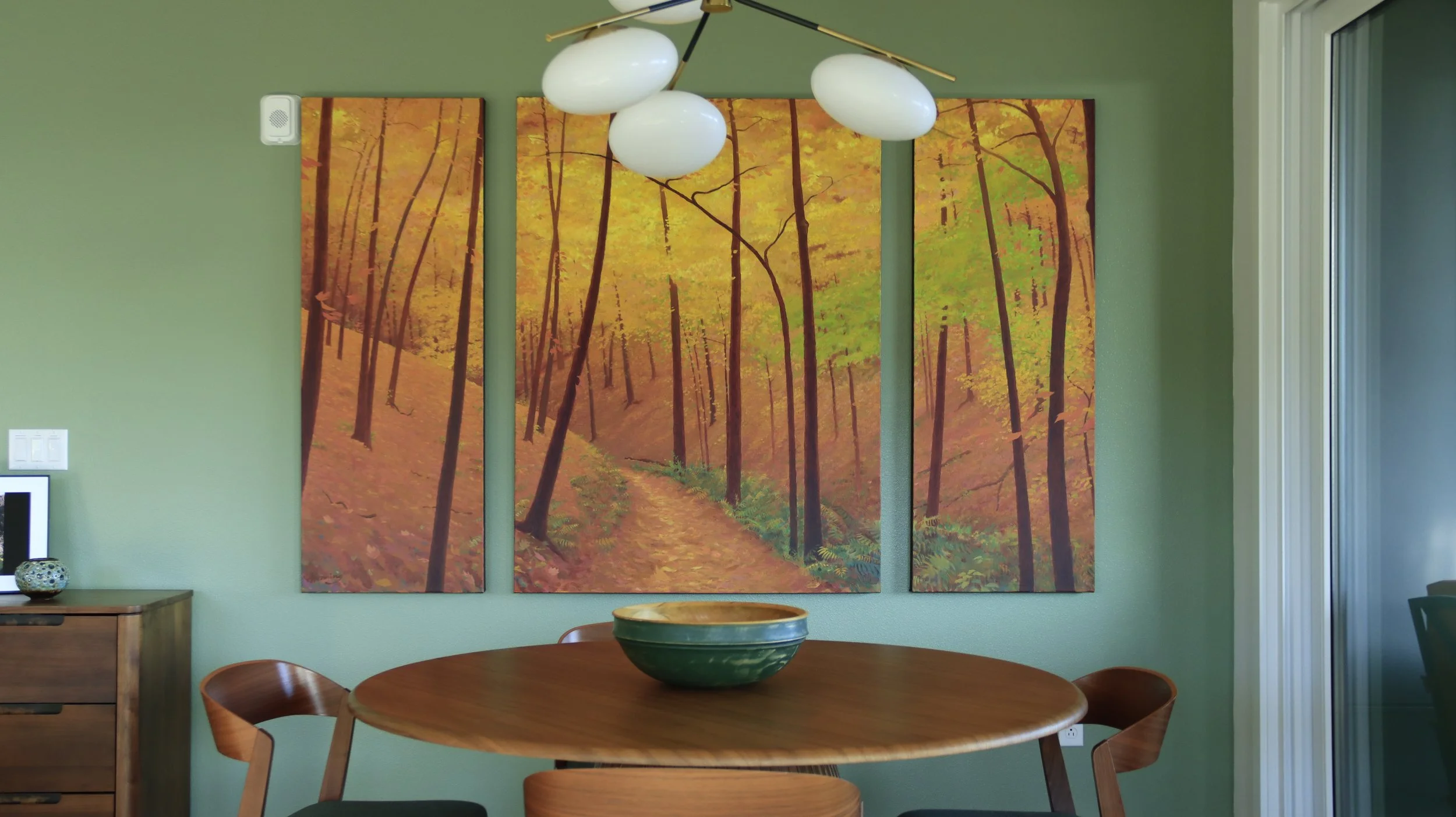 Sylvan Glen landscape triptych by Stephen Henning installed in a contemporary Seattle dining room