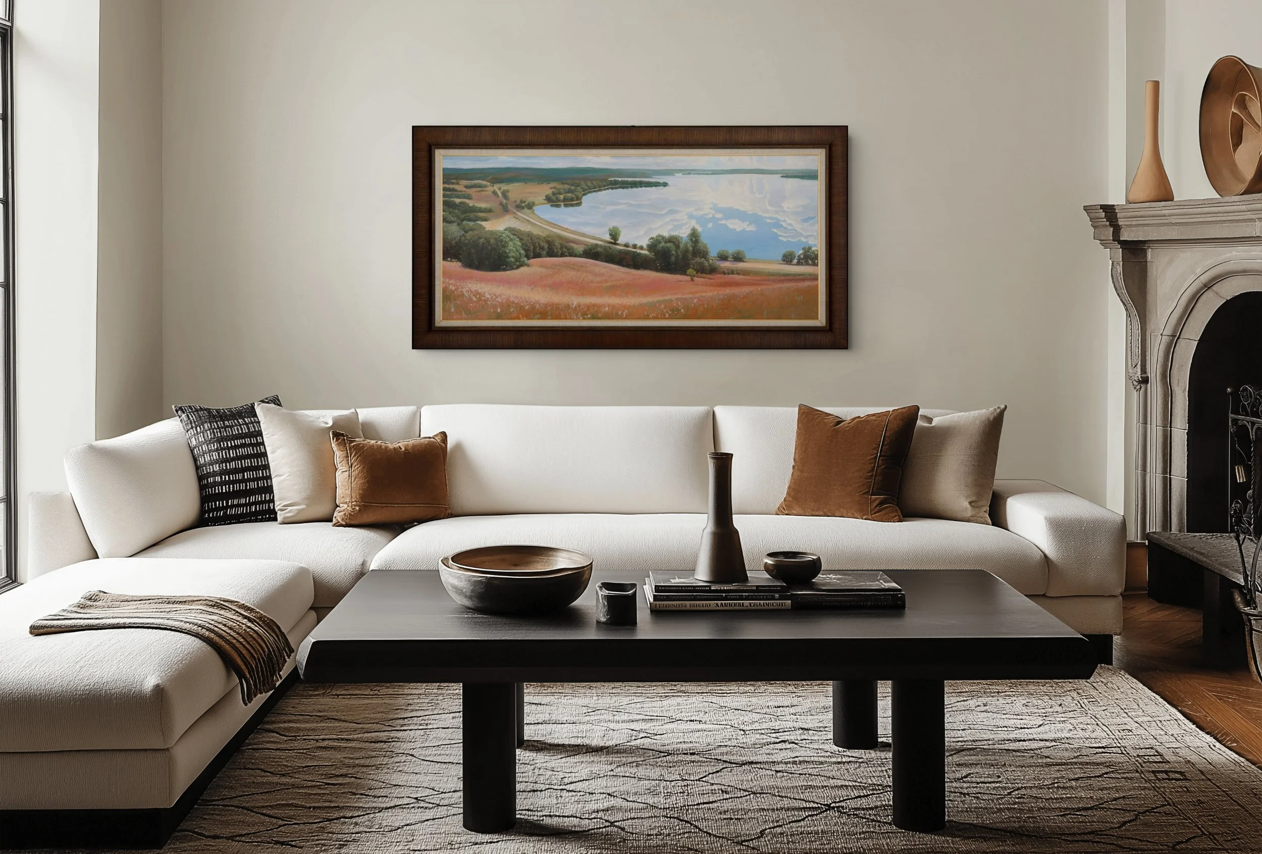 An original landscape painting of Lake Christina displayed above a sofa in a contemporary living room