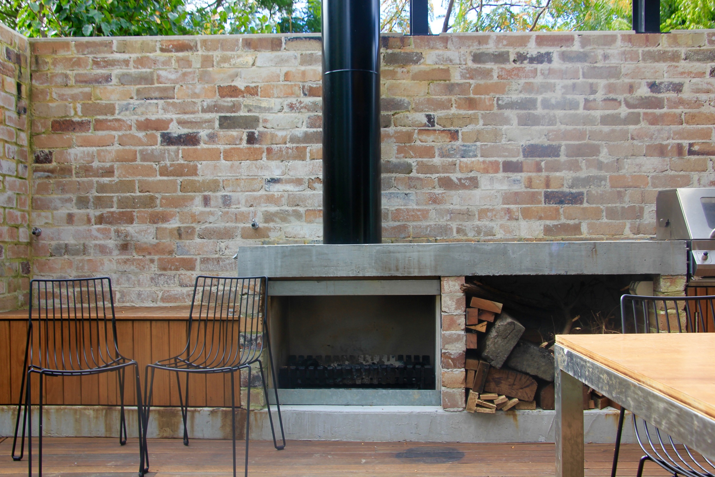 Concrete bbq bench and fireplace.