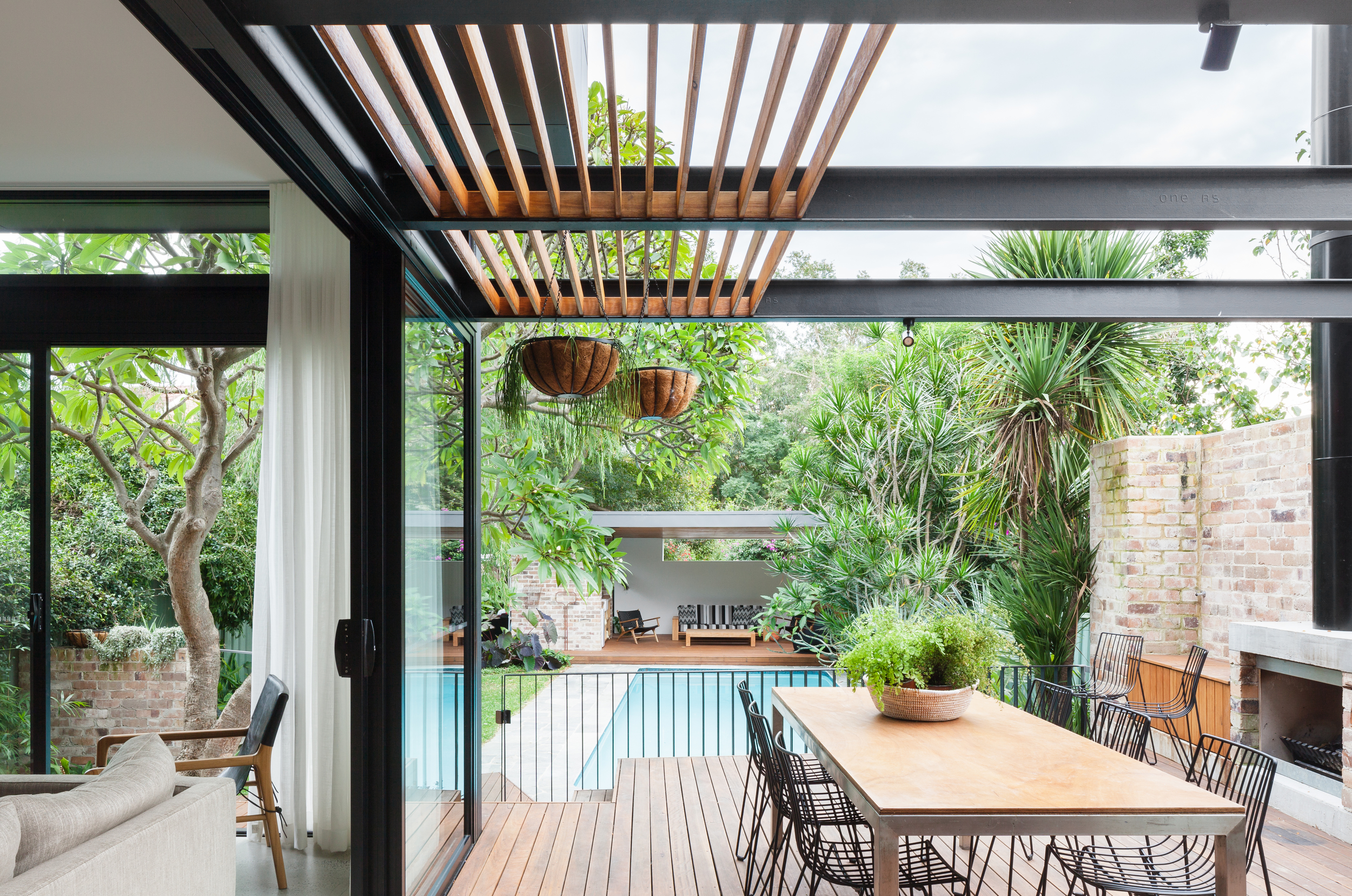 The new entertaining deck looks over the exisitng pool and new raised pool pavilion.
