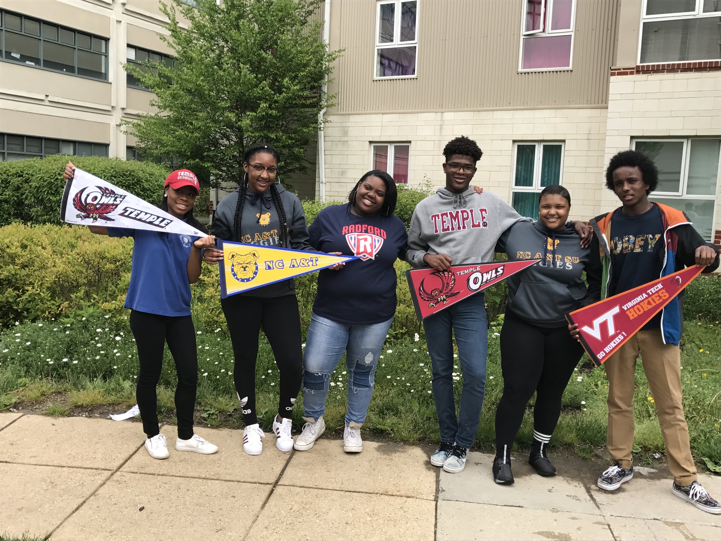 2017 grads with college pennants.jpg