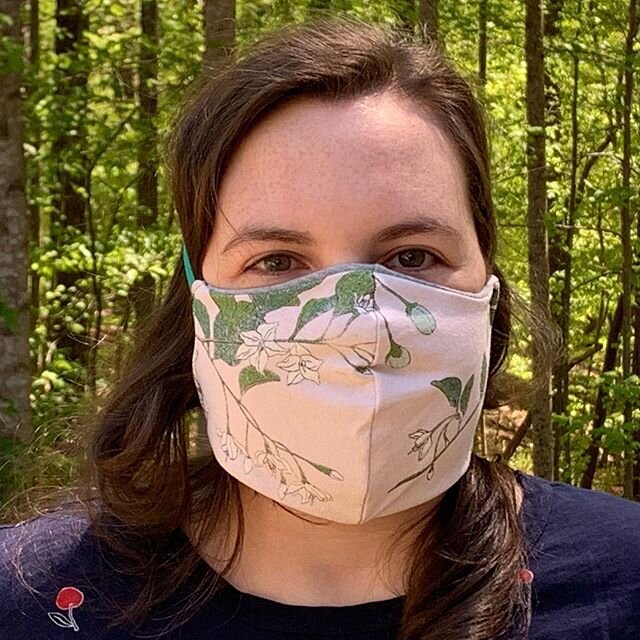 My daughter made us all face masks with HEPA fabric inserts. She saved the best for herself - a Styrax japonicus themed one.