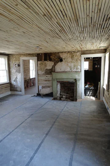 The addition at the rear is one of the largest rooms in the house, but it is not clear when this was added. There is an unfinished attic above, reached by a hidden staircase.