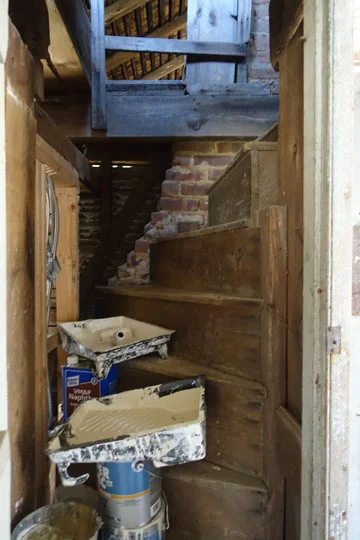 The secret stair to the attic from the shed, temporarily being used as storage for paint.