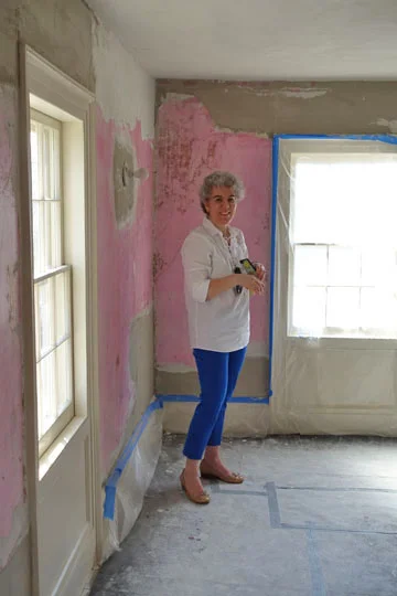Preservation Long Island Executive Director Alex Wolfe (my wife) shows off her “Paint Tape Blue” pants inadvertently color coordinated to the blue paint tape at the second floor hallway.