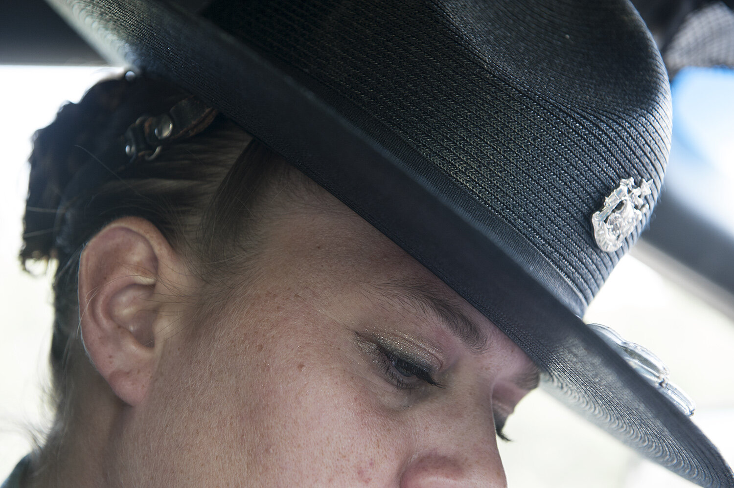 Although always a bit of a tomboy, and perpetually dressed in grays and blacks by choice, Bethany adds a bit of femininity to her life and profession with a small braid she integrates into her bun, and sparkly eye shadow.