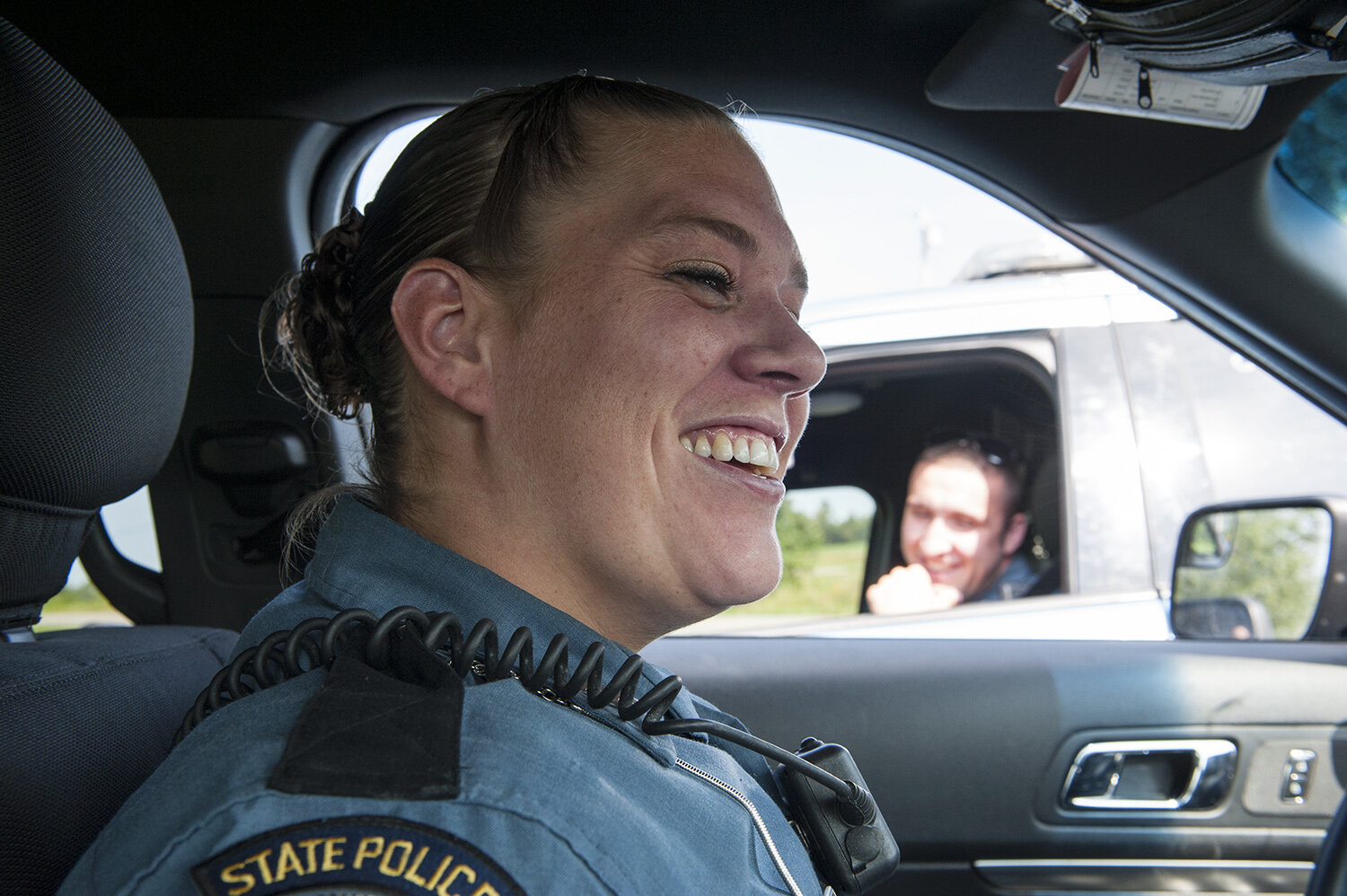 Bethany and another officer exchange jokes and small talk on a meet up while on shift together to keep it light when the day can get stressful. Often reserved, Bethany is even toned and unemotional when talking with the public she serves in highly
