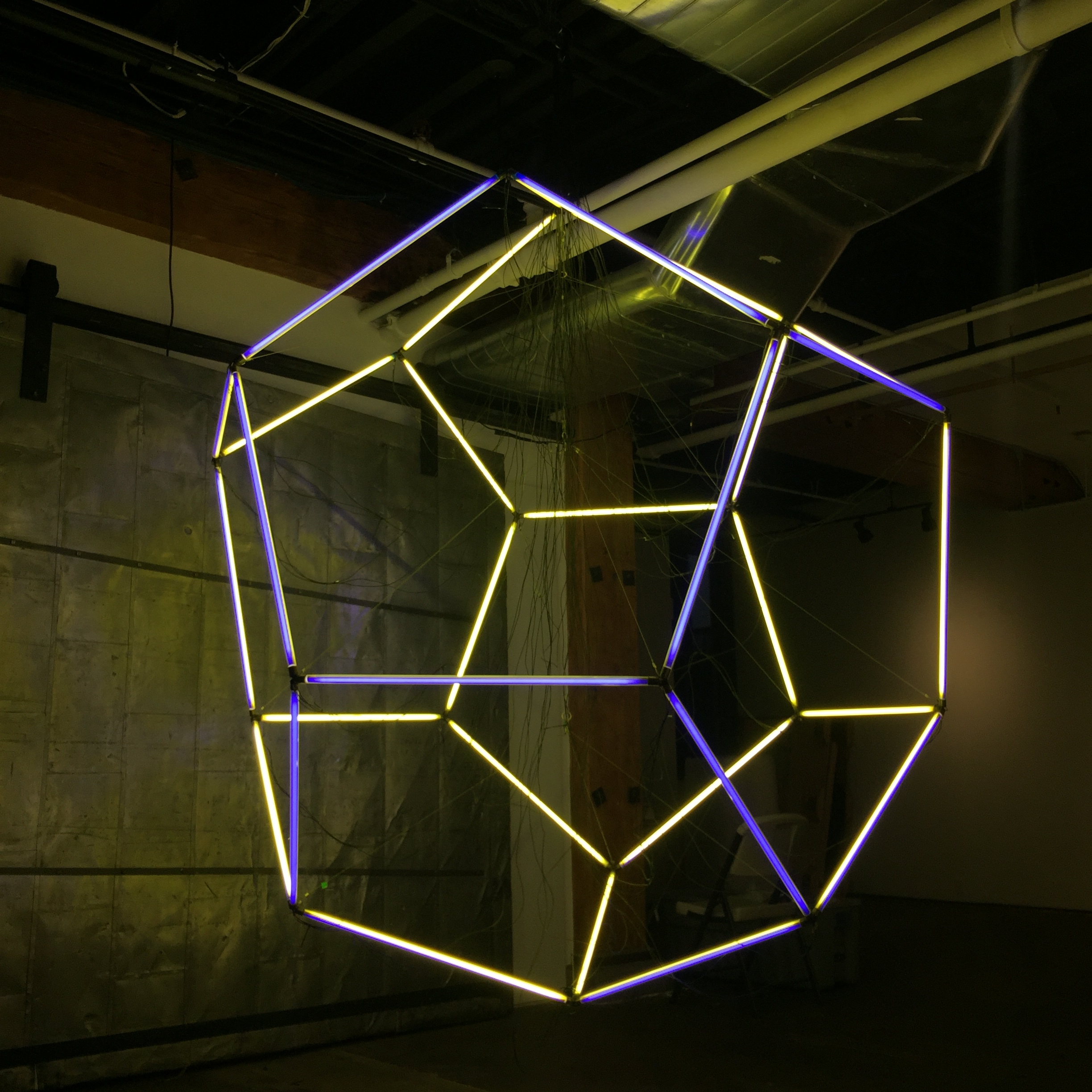   Jason Peters, "Kepler's Myster,"&nbsp;  2016. Mixed Media: fluorescent tubes, custom brackets, wire. 96 x 84 x 84 in.  