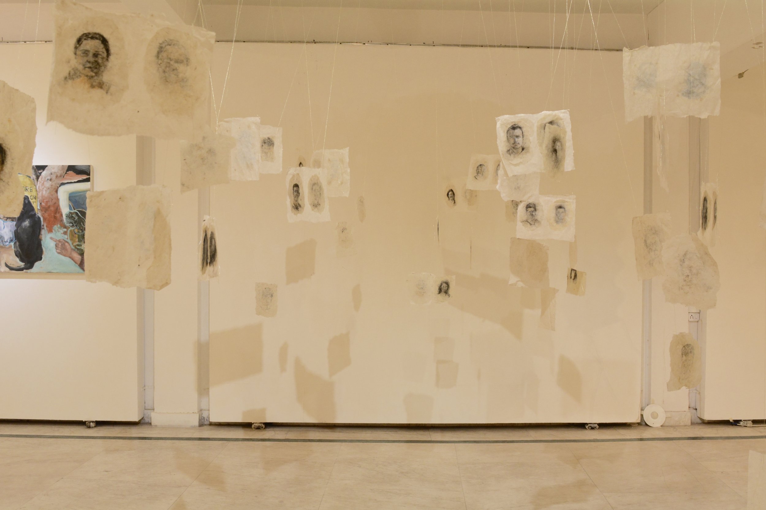viewers were immersed among the faces, much like standing in a crowd.