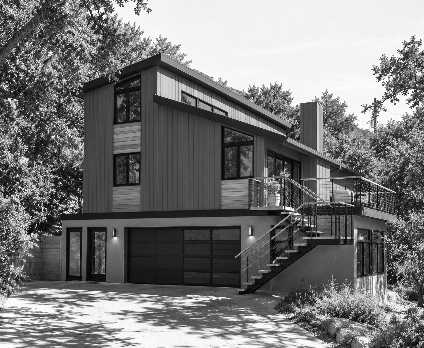 Modern Hillside House Amidst Trees.png