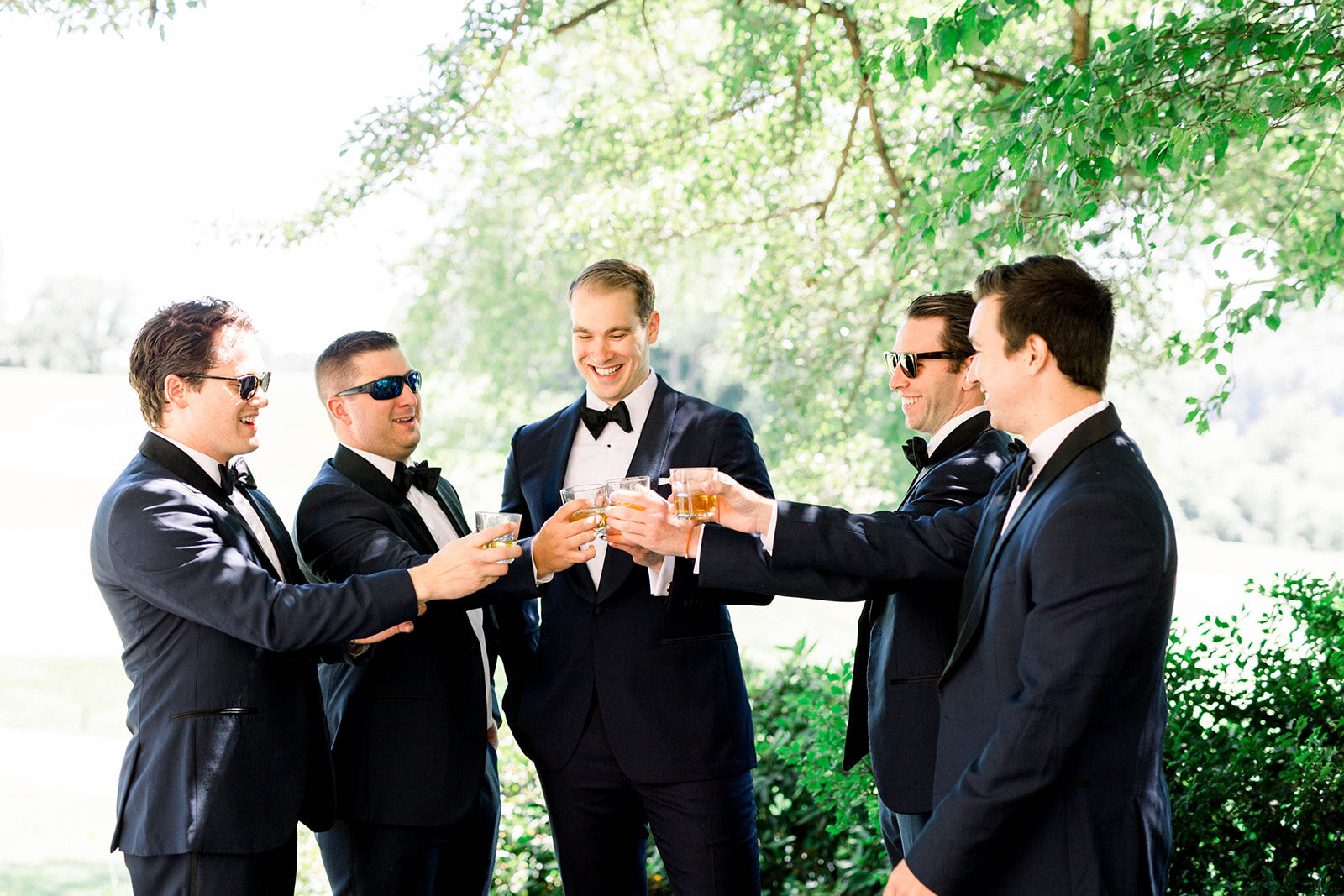 Groom and groomsmen toasting on wedding day: Longue Vue Club Wedding captured by Abbie Tyler Photography