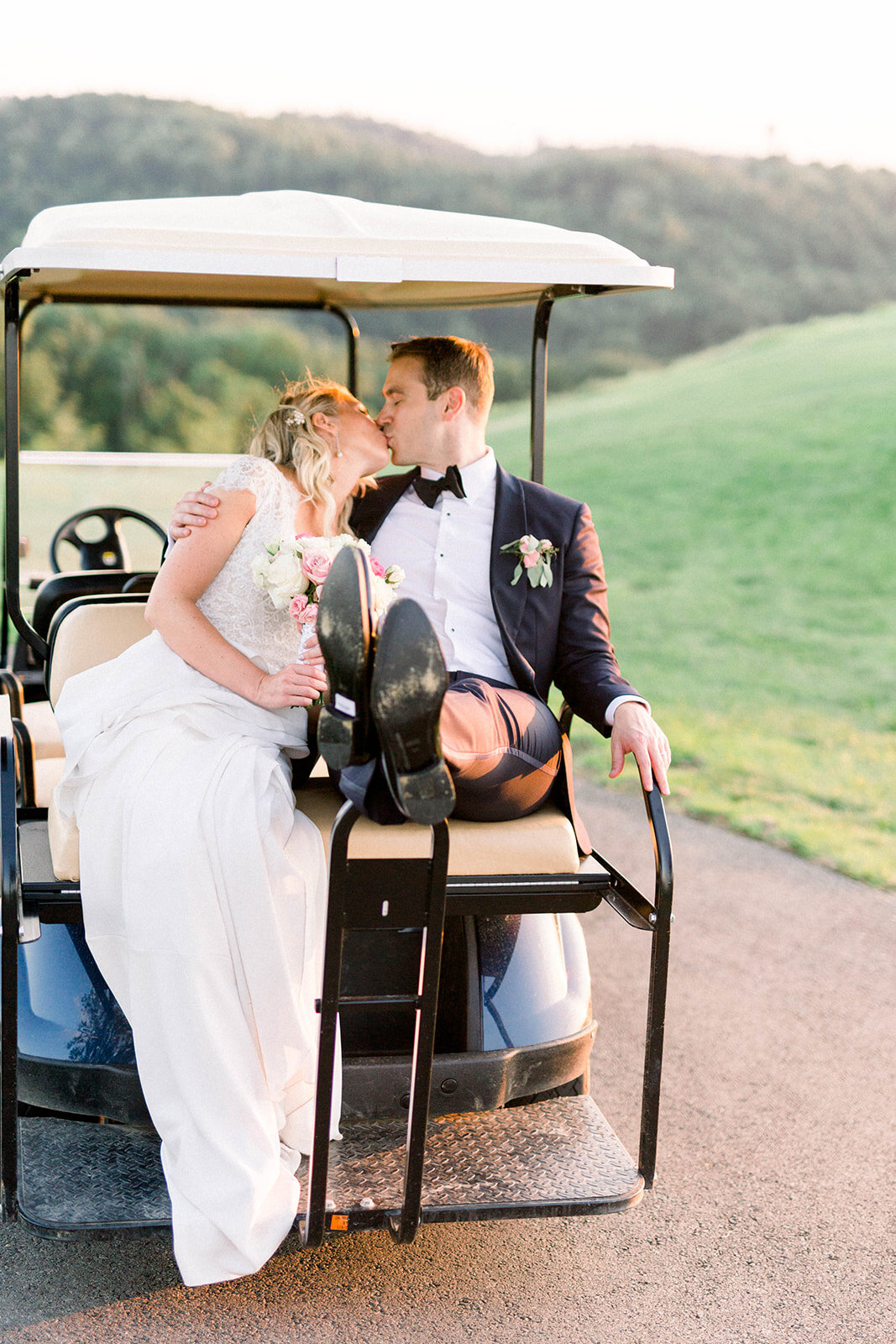 Bride and groom kissing on golf cart: Longue Vue Club Wedding captured by Abbie Tyler Photography