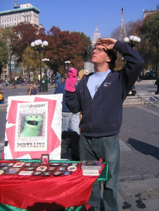 Happy NYC 20 to me. Time is made up yet somehow twenty years ago I showed up with a TV tray and a suitcase full of Sock Puppet Portraits in Union Square Park. I had absolutely no idea it would become my career and family business.  A lot has both hap