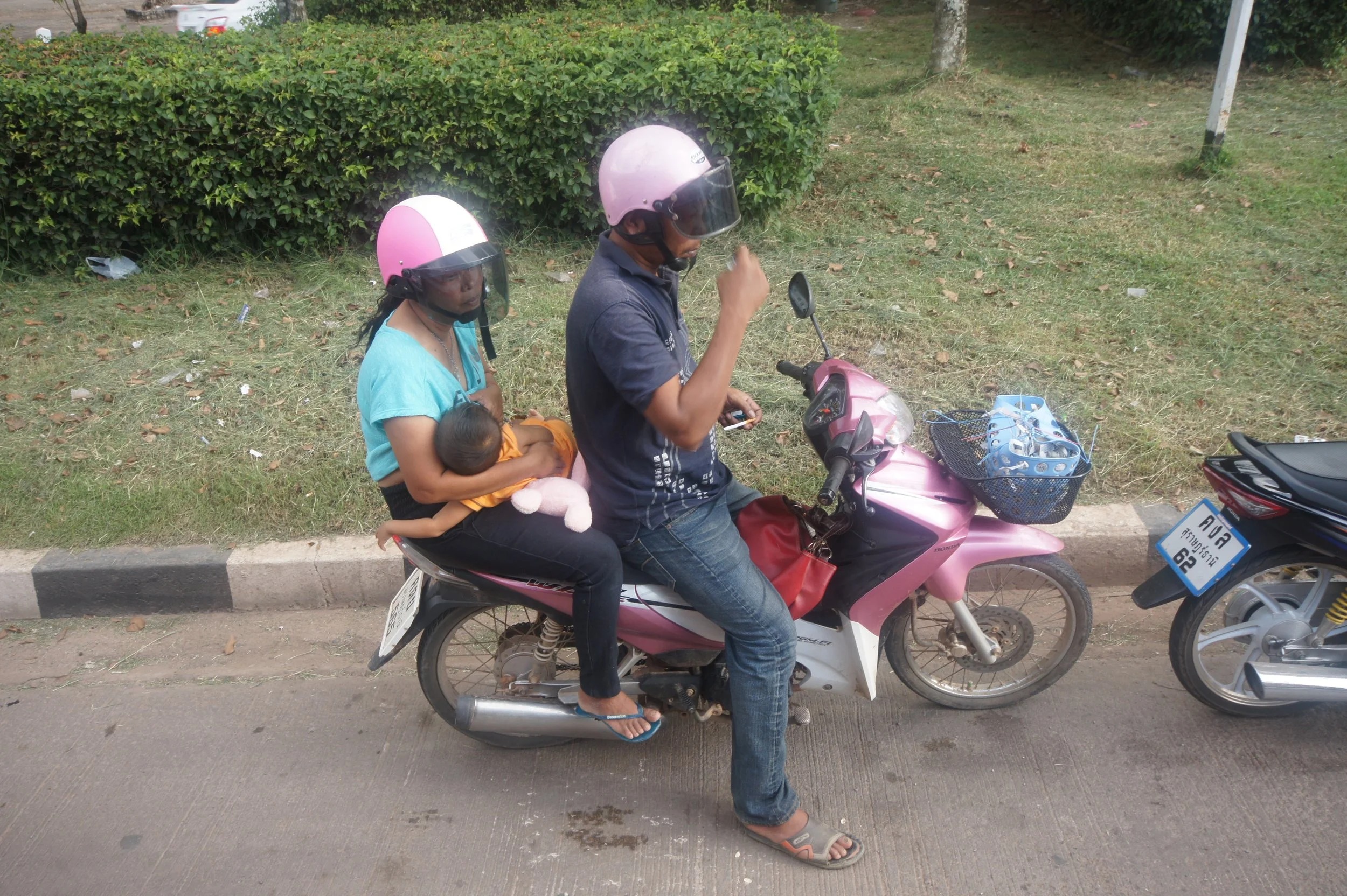 Moped in Thailand family on one bike