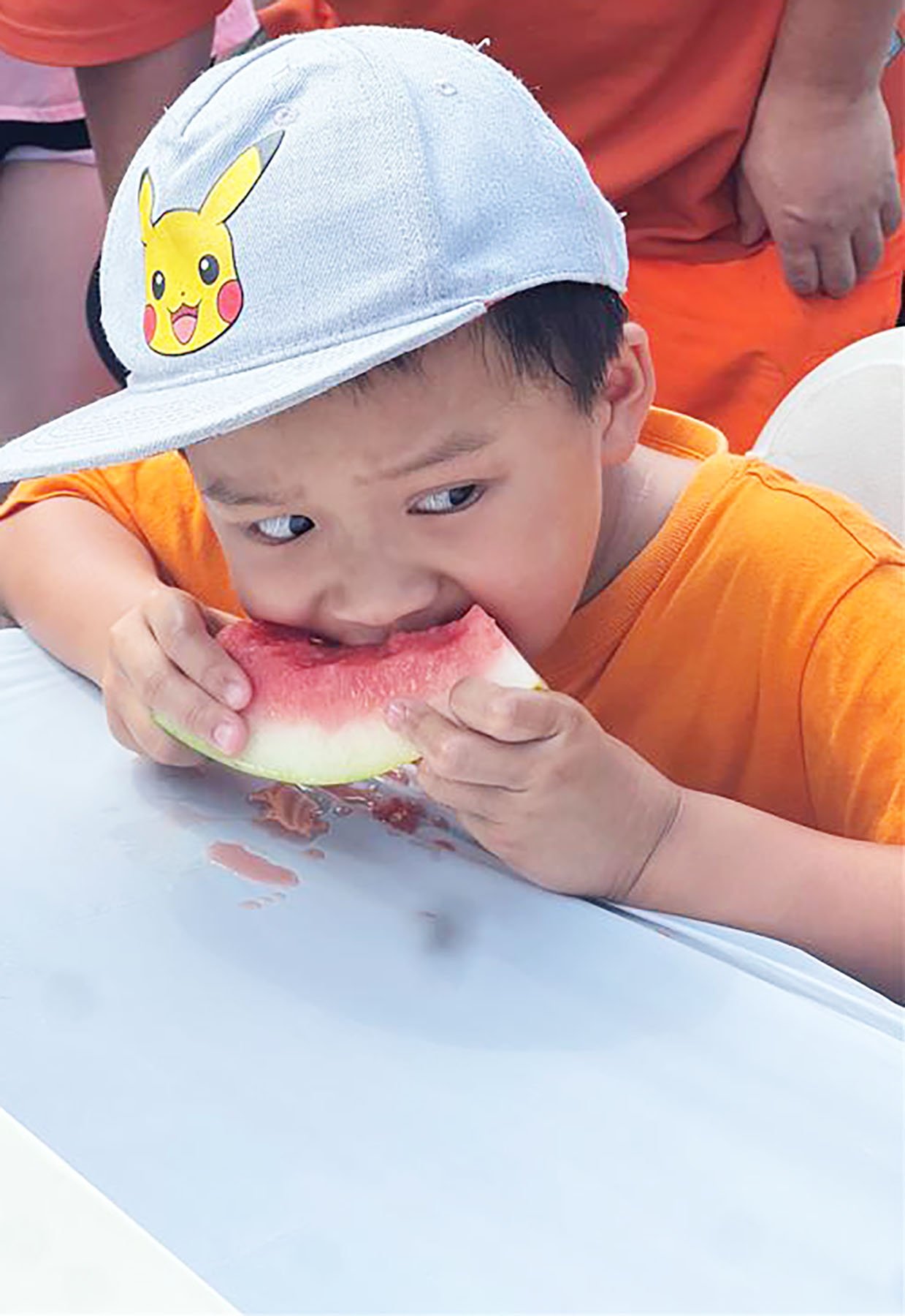 anxious boy eating watermelon.jpg