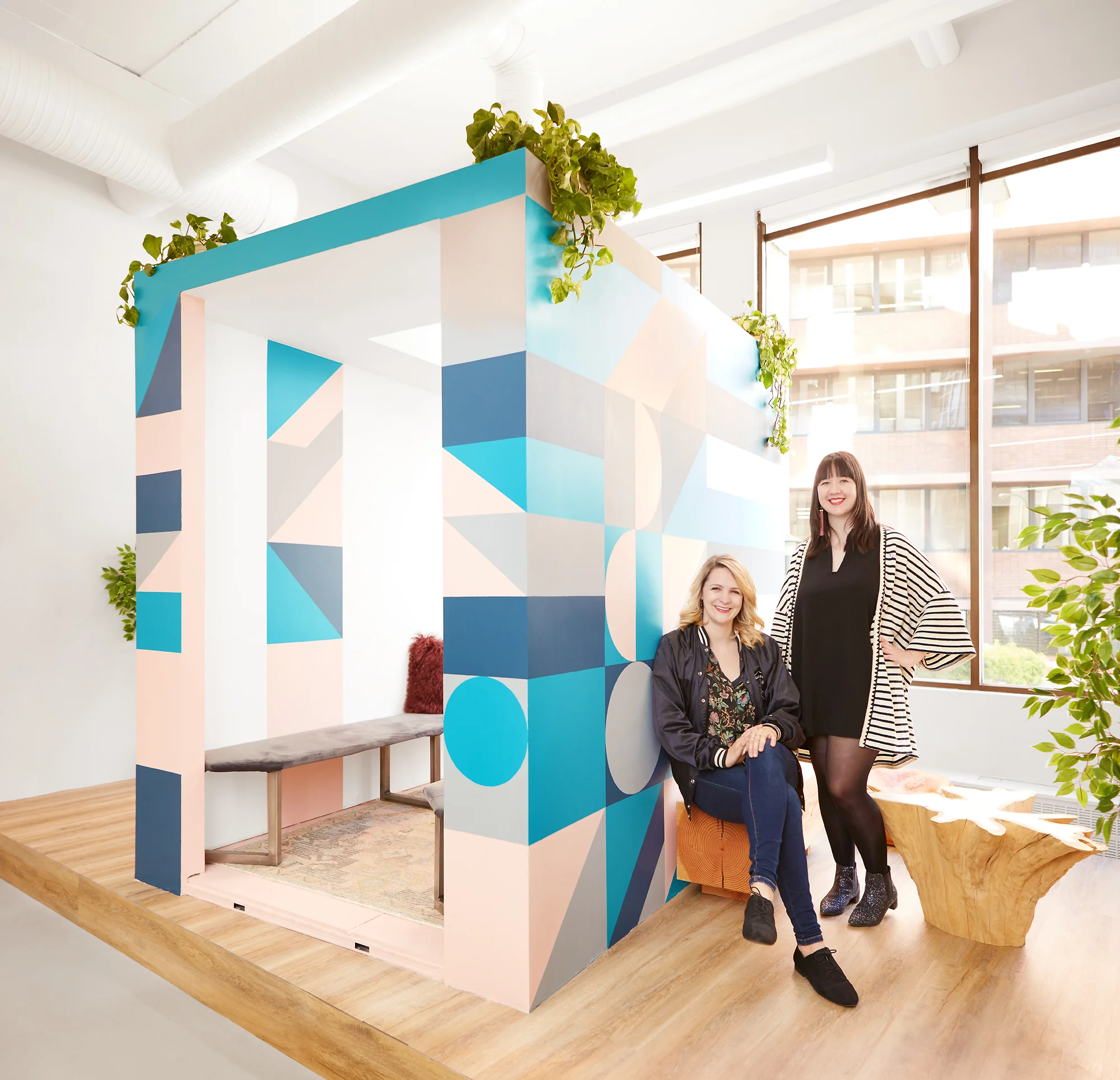 Tara and Jamie with their mural at The Profile.
