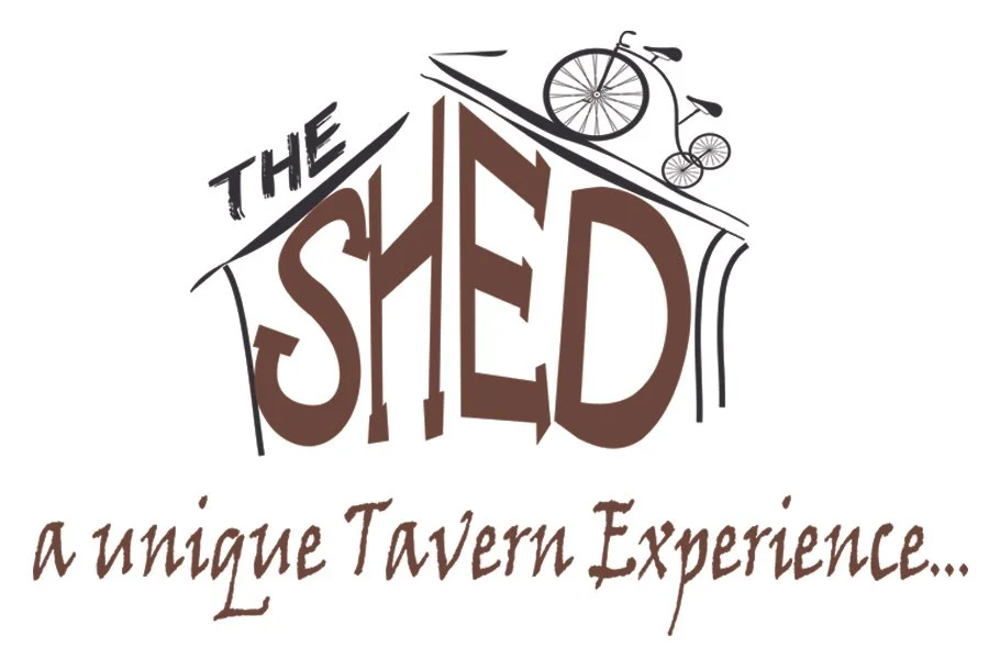Logo for The Shed, a tavern with a large stylized sign, featuring a bicycle on a roof and the tagline "a unique Tavern Experience."