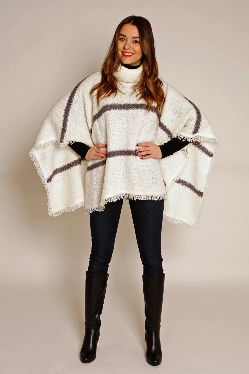 Although ponchos can appear to be an easy item to wear, it’s important to choose one that fits your frame. Make sure that it is not too small or to big but that it fits your frame — otherwise you will drown in it. Necklines such as cowl neck, turtleneck, V-neck, scoop neck, crew neck, and boat neck are great as they frame your face and upper body. While boat necks and crew necks tend to make the chest and shoulders look wider, they are perfect if you have narrow shoulders or a small bust. V-necks are especially good for women with broad shoulders or a large bust, as they have a slimming effect. If you have a longer neck, go for a turtleneck that has a shortening effect through the neck and face. If you want to elongate your frame, opt for a ponchos that falls no lower than just above your knee. Petite ladies should be aware of long ponchos as they will overwhelm your shorter stature.The fine knit triangle-shaped poncho, in a shorter length, is perfect for smaller frames.