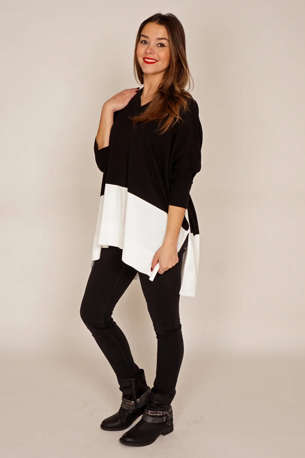 Since the poncho's popularity is booming, it’s time to take advantage of its benefits this season. The only rule necessary to keep in mind when wearing a poncho is that the large volume that it gives you on top must be offset by a slim/minimalist style on the bottom. The poncho is popular simply because it's so easy to wear. It goes with everything. One size fits all. It's never too tight. Season after season, ponchos retain their "go to" popularity in our wardrobes – from cool Summer nights to the coldest days in December. They make the perfect in-between-days outerwear when it’s just a little too warm to wear a coat. Juanita actually finds it warmer than a fall coat as the arms are closer to the body and it seems more effective blocking the wind. She's been a poncho lover since her early 20's. It's also easier to layer, as it fits over bulkier sweaters, whereas it can be much more constricting trying to get that sweater into a coat.