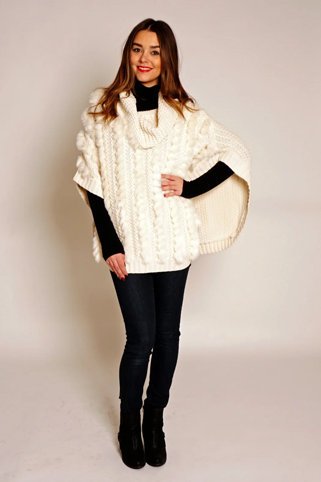 Wear your poncho with slim-fitting trousers, skinny jeans, leggings, pencil skirts, and slim-fitting miniskirts paired with knee-high boots, ankle boots, and high heels for a chic look. Keep your accessories modest, especially if your poncho is your statement piece. Keep chunky jewellery to rings and or bracelets. Switch up your shoulder or larger bag, for a clutch or a small crossover bag as will be less bulky underneath you poncho. There are few wardrobe staples that look as good with your casual wear as they do dressed up with heels, but ponchos are the exception.