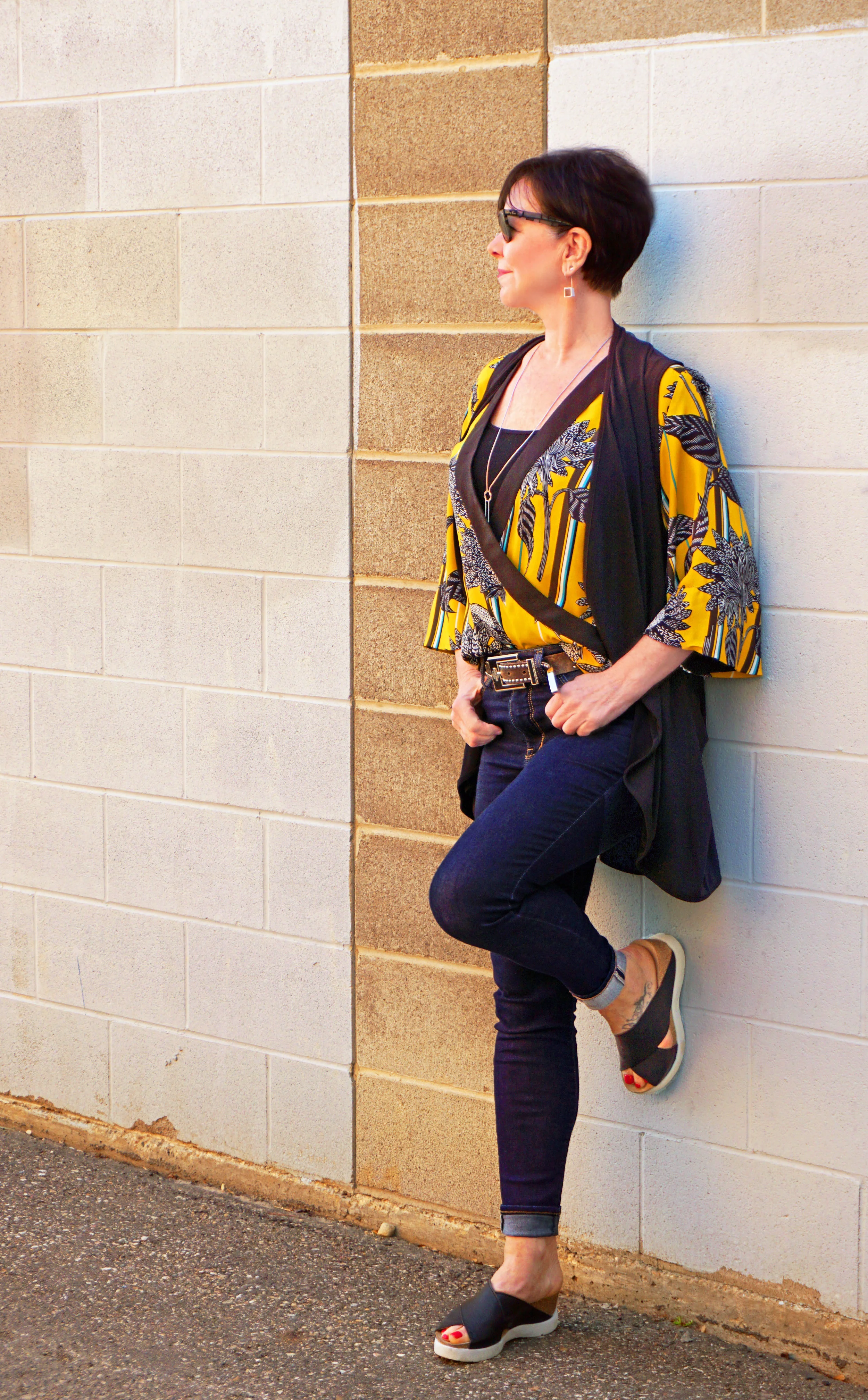 With this look, Colleen has added the Class Act vest from Sympli to tone down the vibrant yellow blouse.