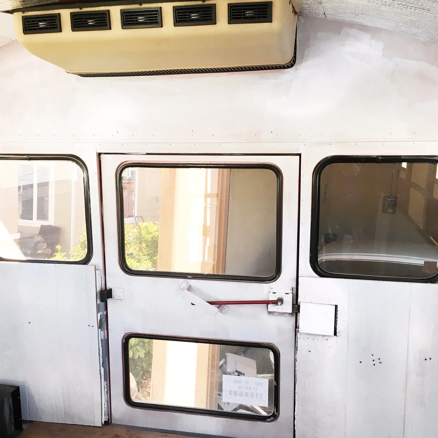 Oil base primer, the first step in covering all that pink paint.
