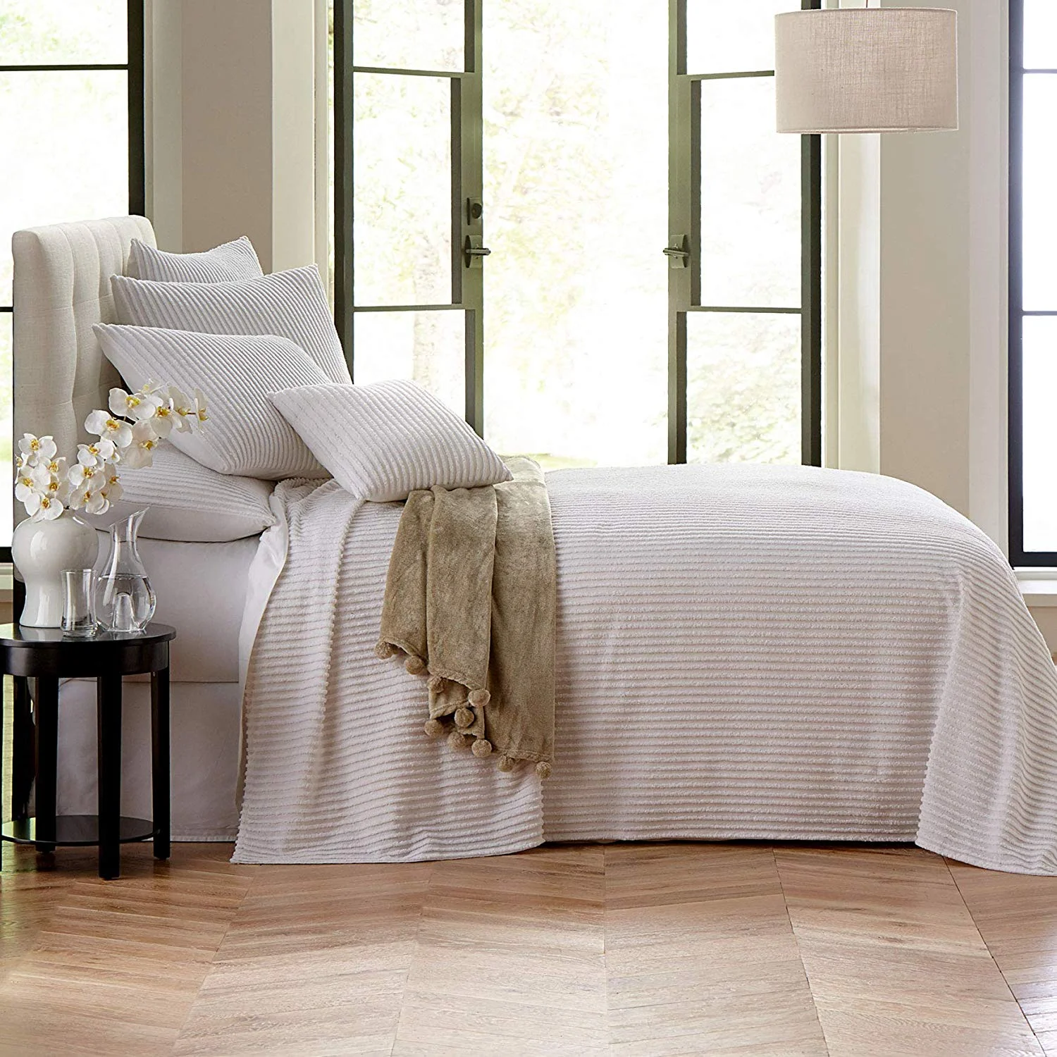 The modern clean lines of this chenille blanket would be beautiful in a modern farmhouse bedroom.