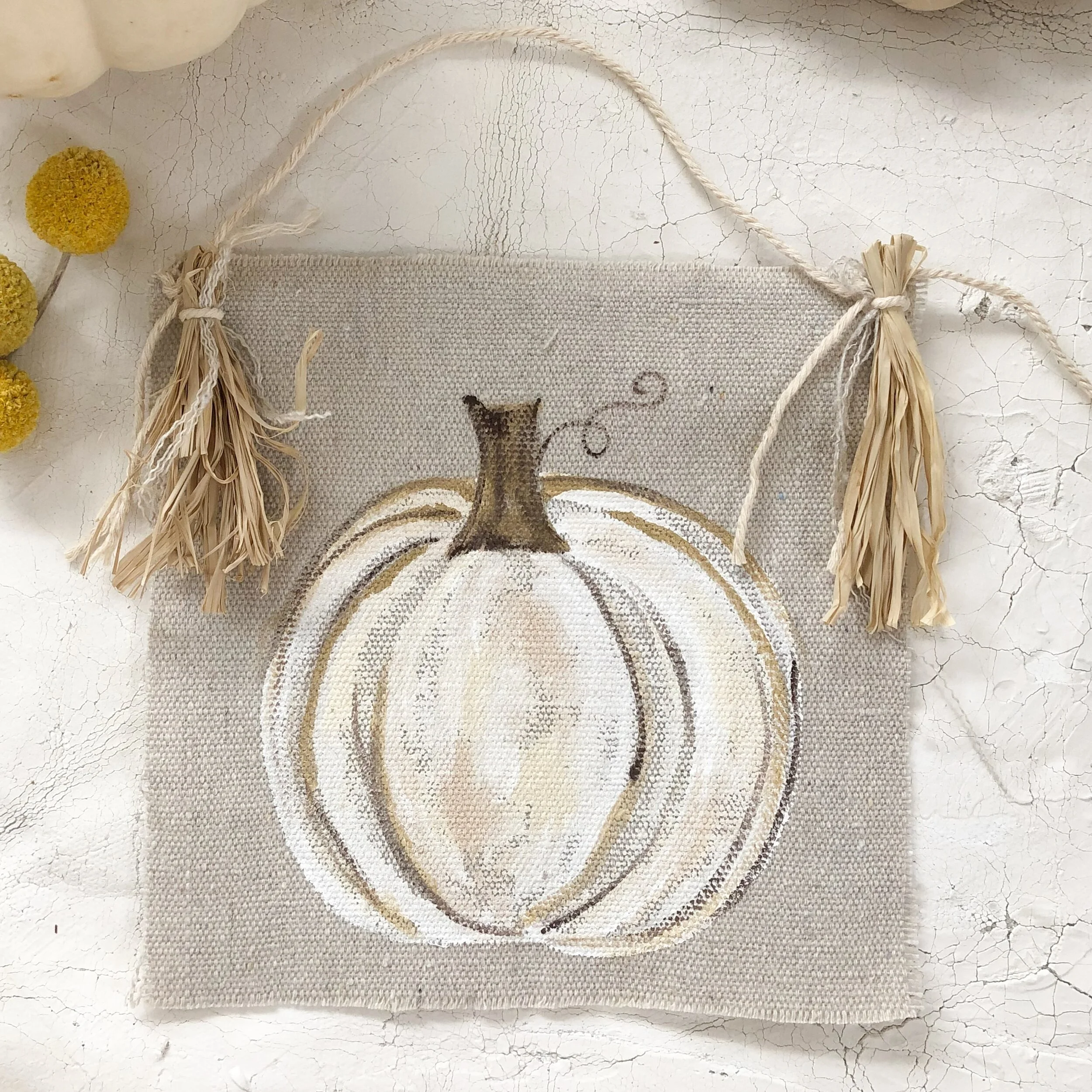 white pumpkin halloween decor with raffia tassels neutral fall decoration 22.jpeg