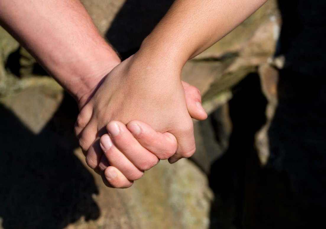 Man and Woman Holding Hands via Storyblocks.jpg