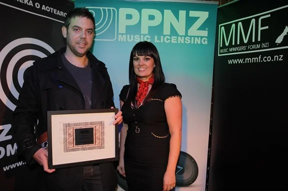 Scott Grafton winner of Upcoming Manager with presenter Tami Neilson