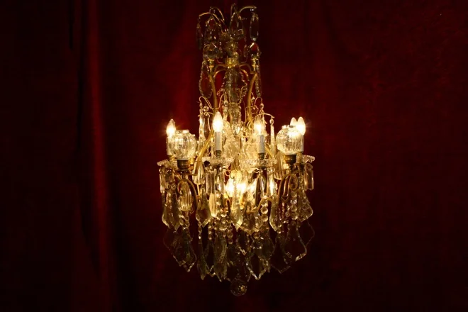 ANTIQUE BRASS AND CRYSTAL CHANDELIER