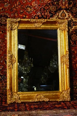 Wood framed mirror with antique style finish  