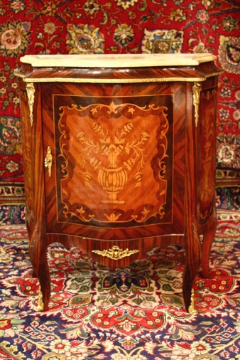Medium sized inlaid cabinet with marble top  