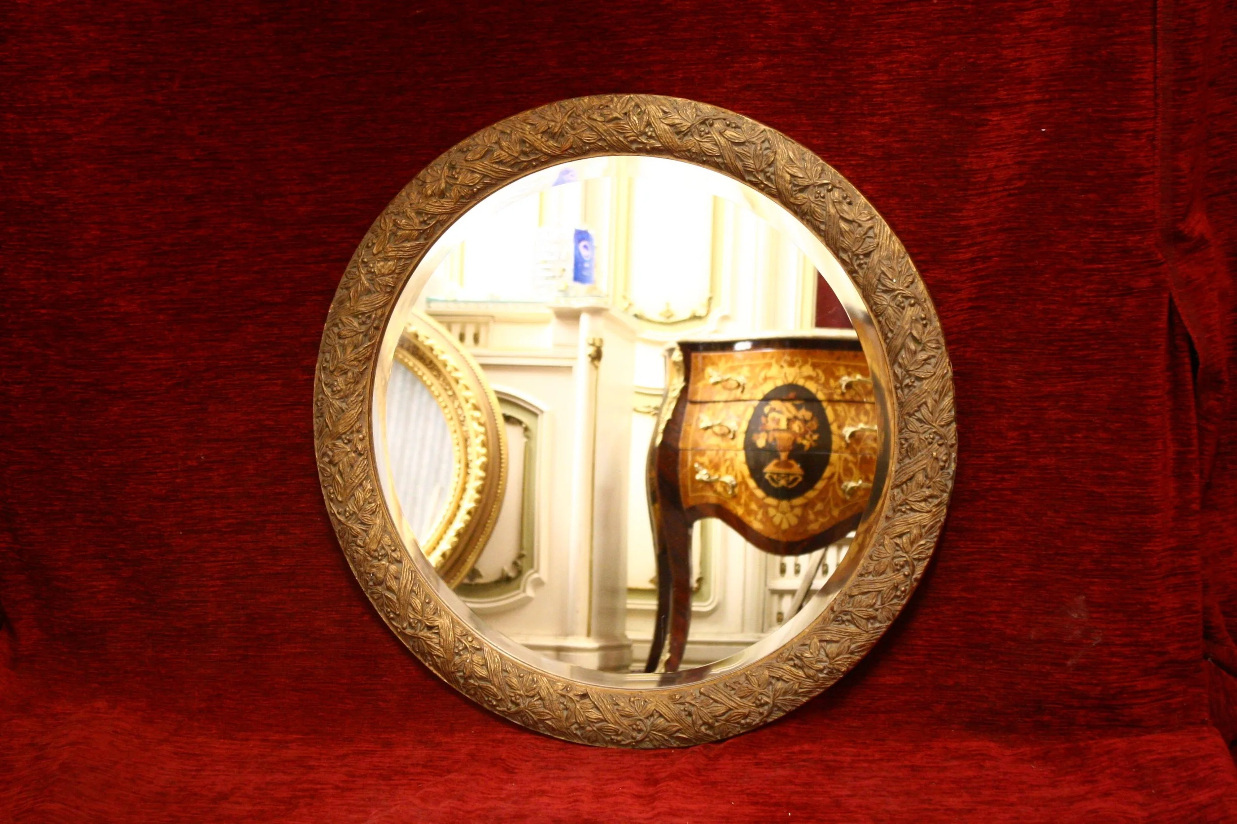 Small round carved wood gilt mirrors