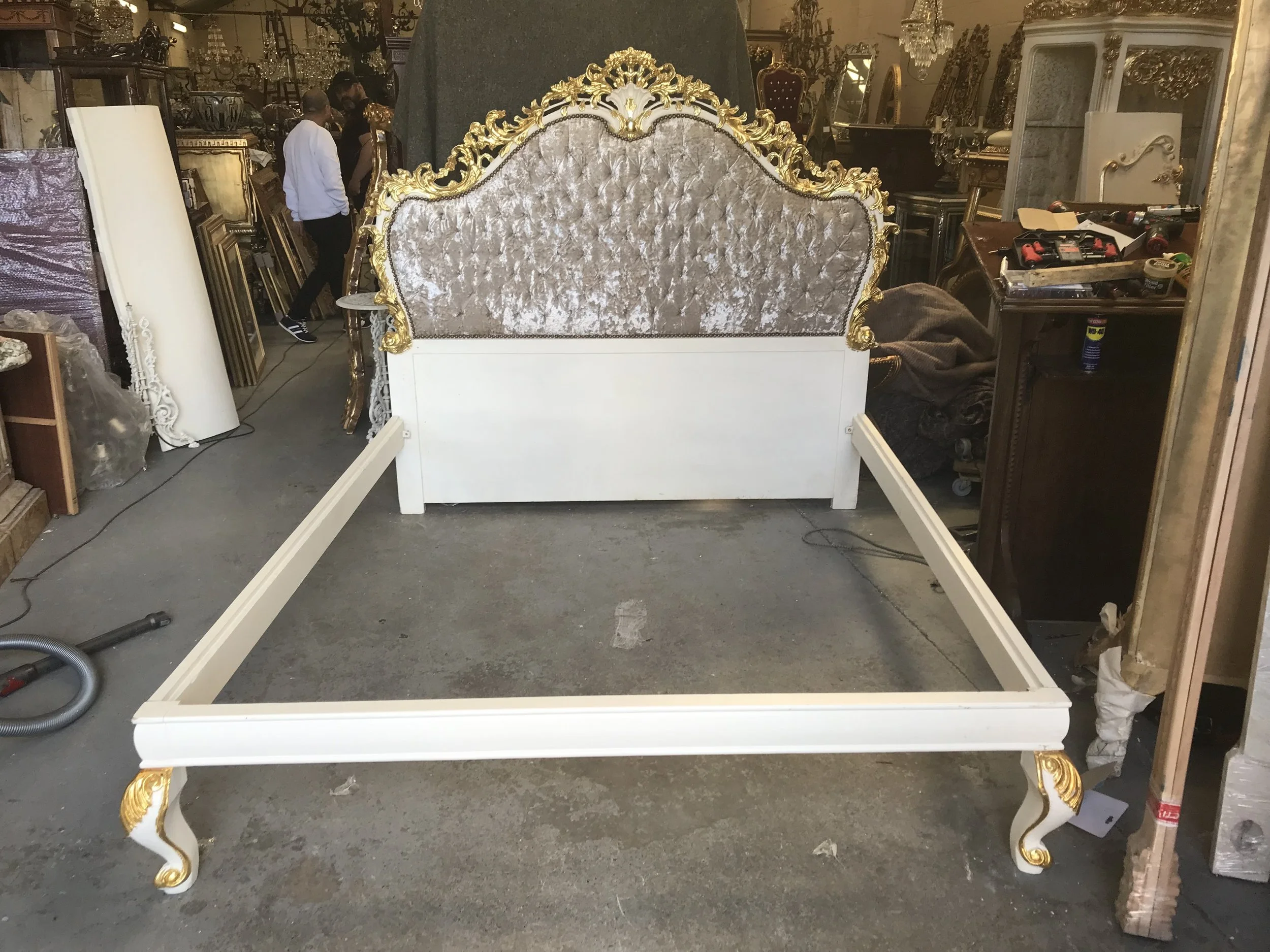 Antique style solid carved wood bed in white with gilt highlights