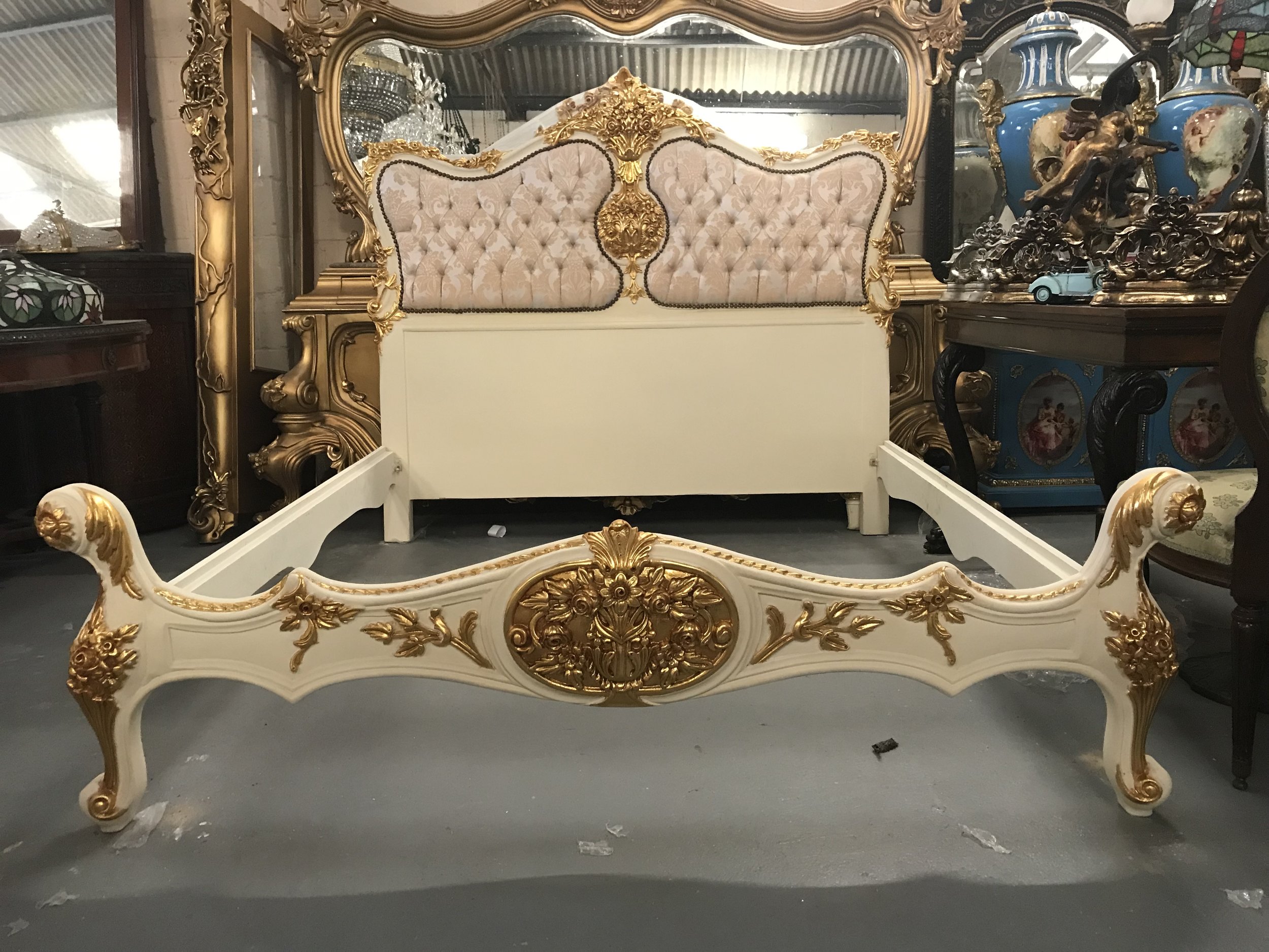 Modern carved wood bed in the antique style