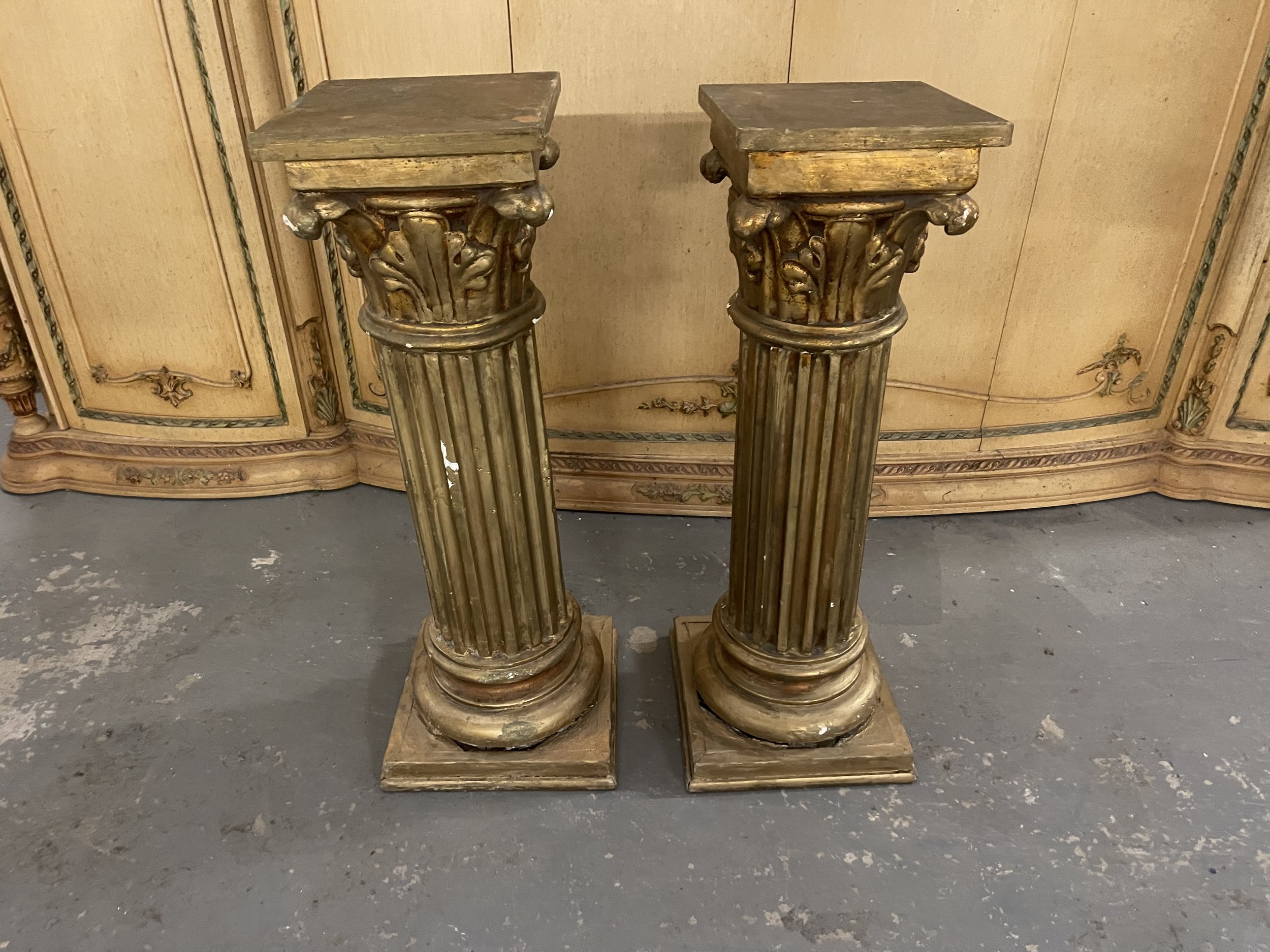 Pair of heavy gold pillars
