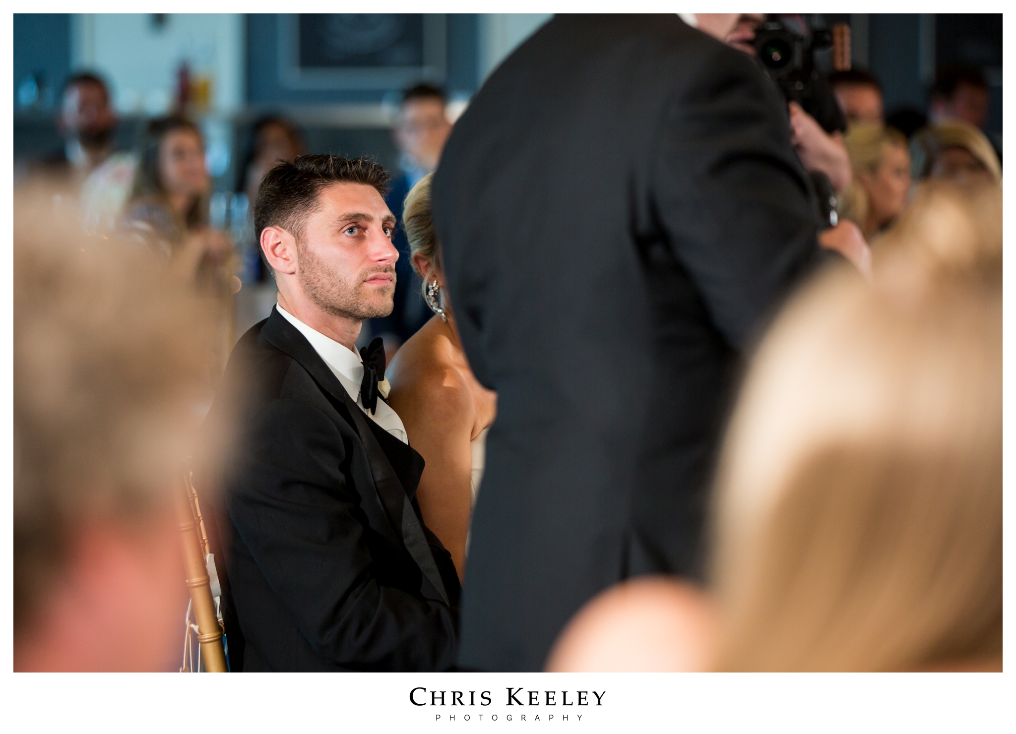 groom-listening-to-toasts.jpg