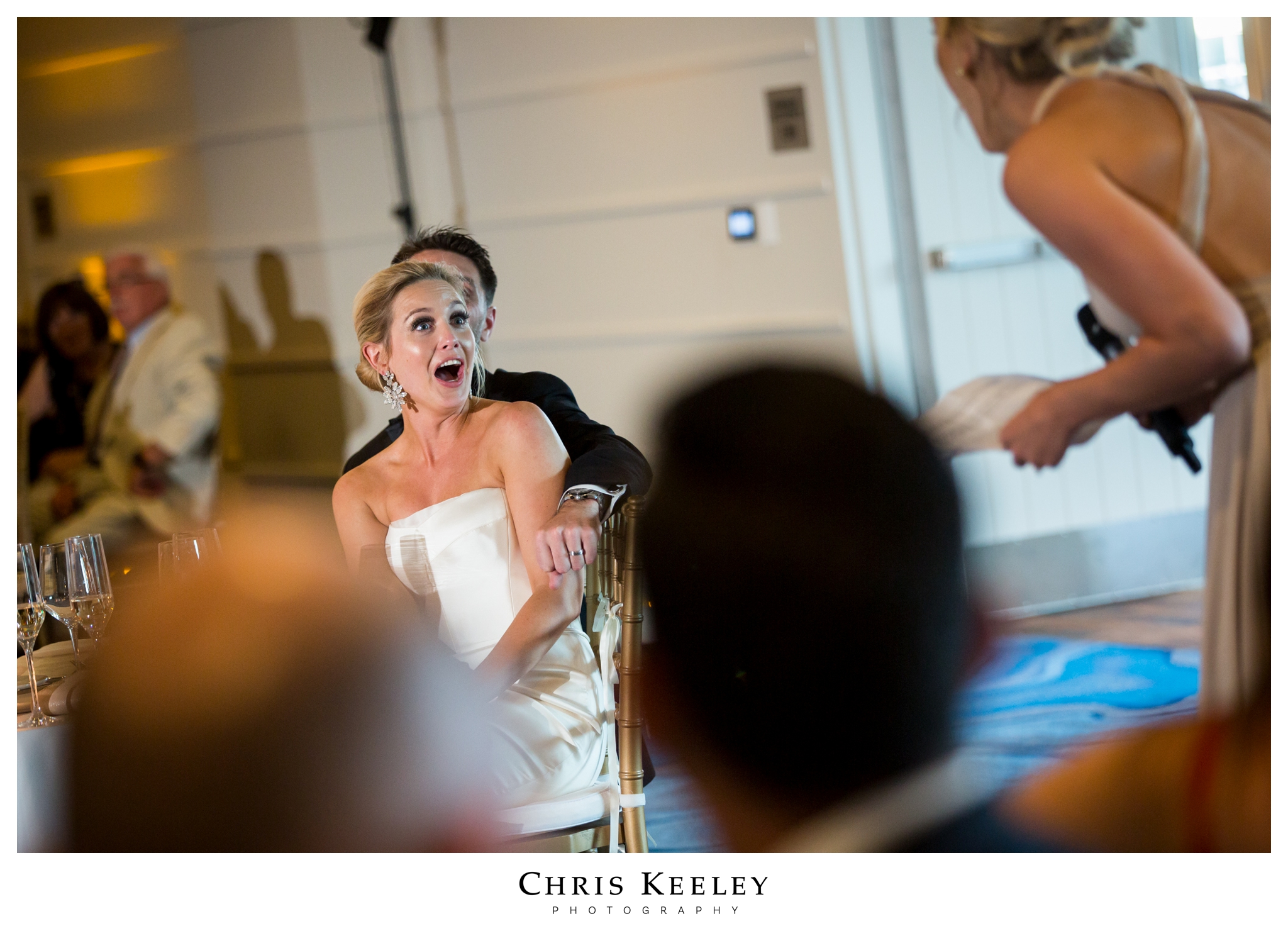 bride-looking-at-maid-of-honor-toasts.jpg