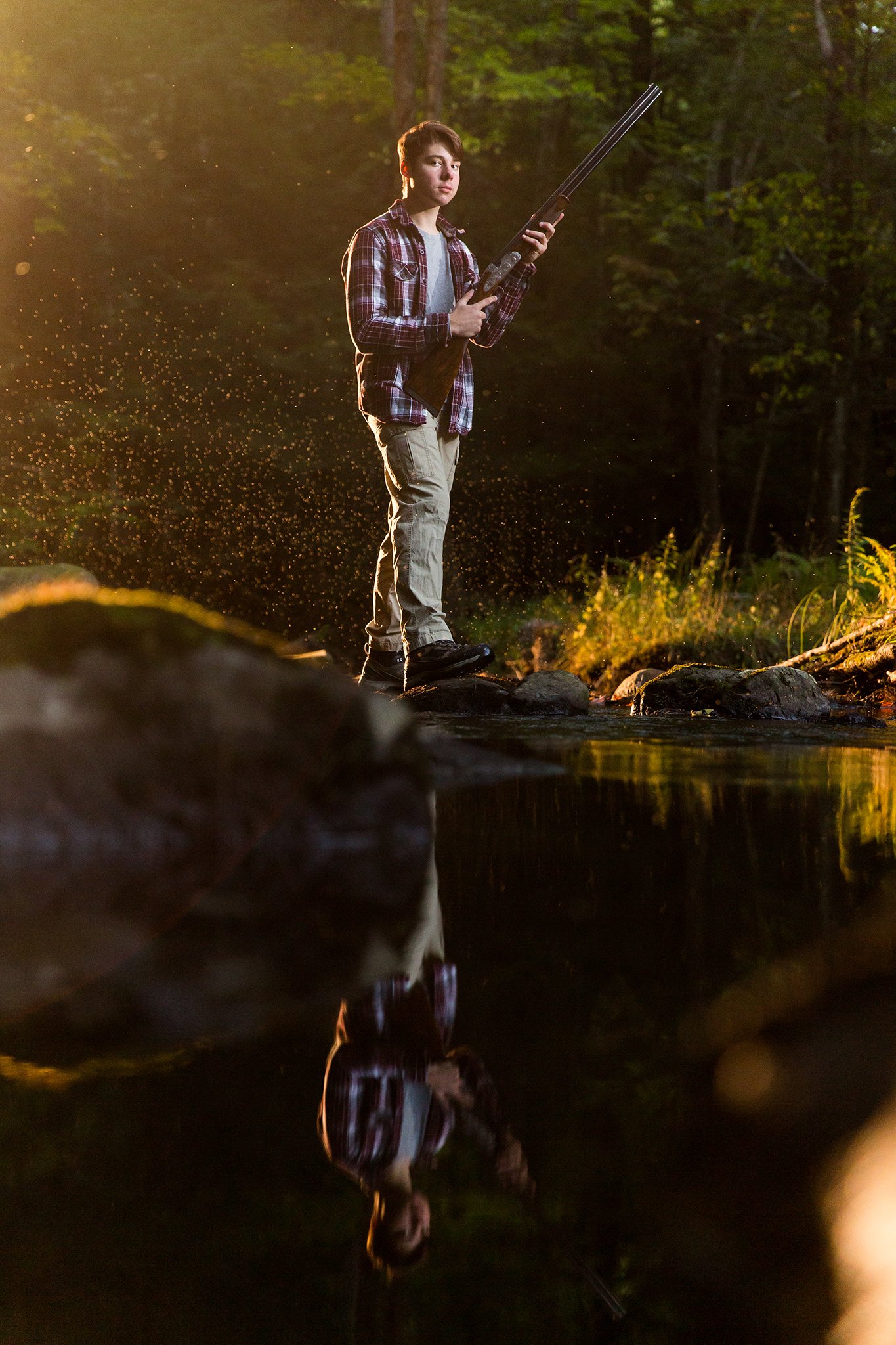 senior-portrait-with-rifle-sports-theme.jpg